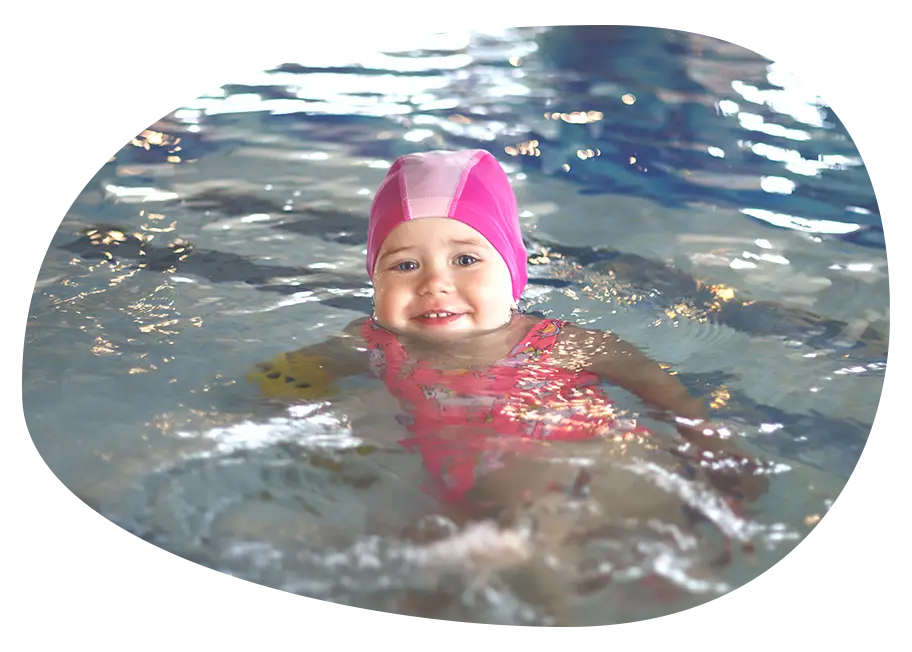 little girl in a pool cap and pink swimsuit learns 2024 12 03 17 30 54 utc
